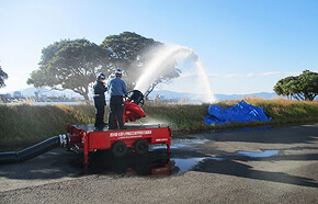 Spraying the extinguishing agent toward the sea