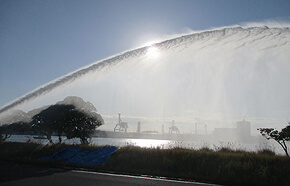 Spraying the extinguishing agent toward the sea